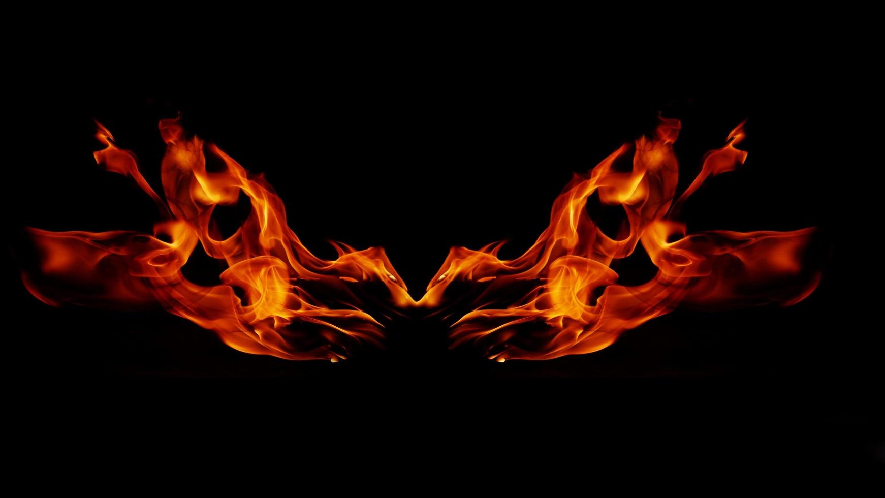 Flame Flame Texture For Strange Shape Fire Background Flame meat that is burned from the stove or from cooking. danger feeling abstract black background Suitable for banners or advertisements. photo