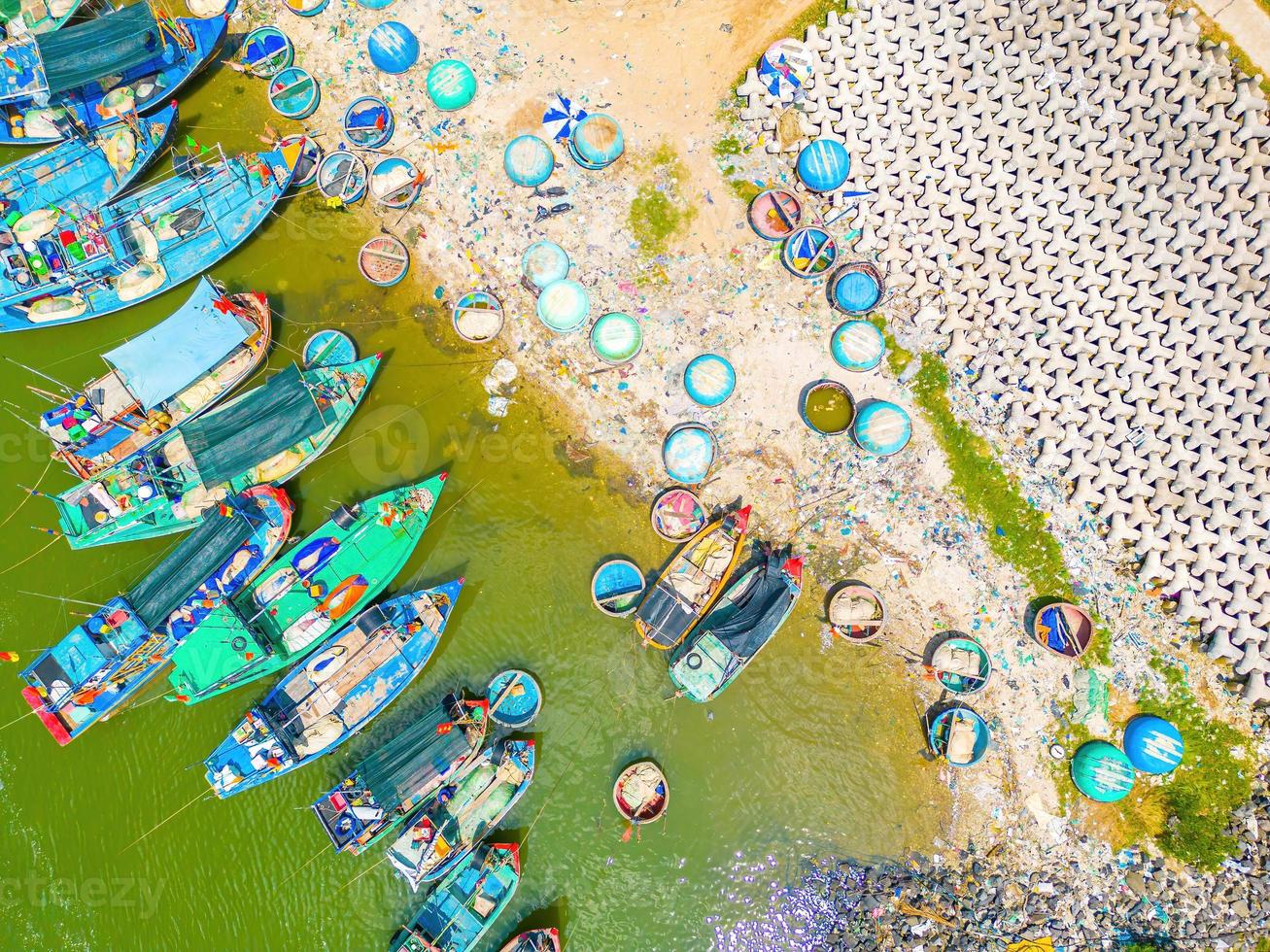 Beautiful blue skyline panoramic in Loc An Canal. Scenery landscape of fishing port with tsunami protection concrete blocks. Cityscape and boats in the sea. Loc An village near Vung Tau City. photo