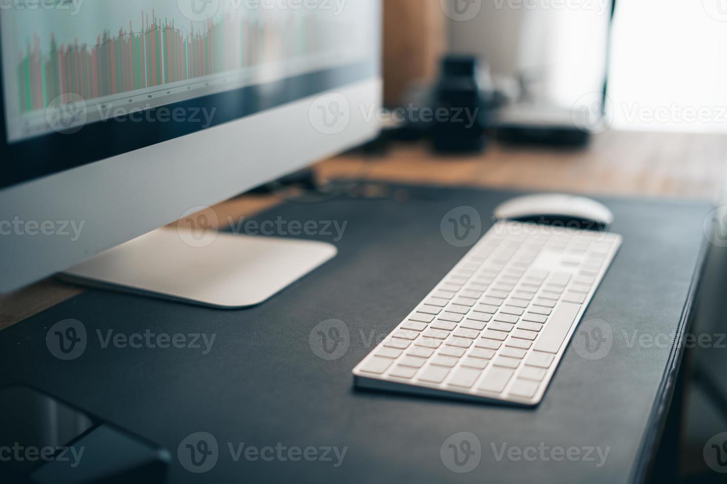 Man working on computer desk at home office photo