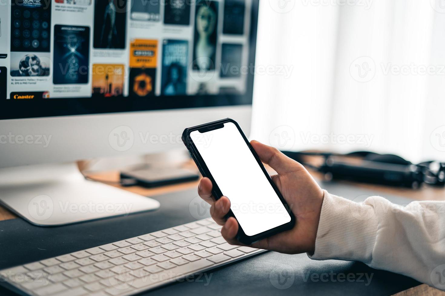 Man working on computer desk at home office photo