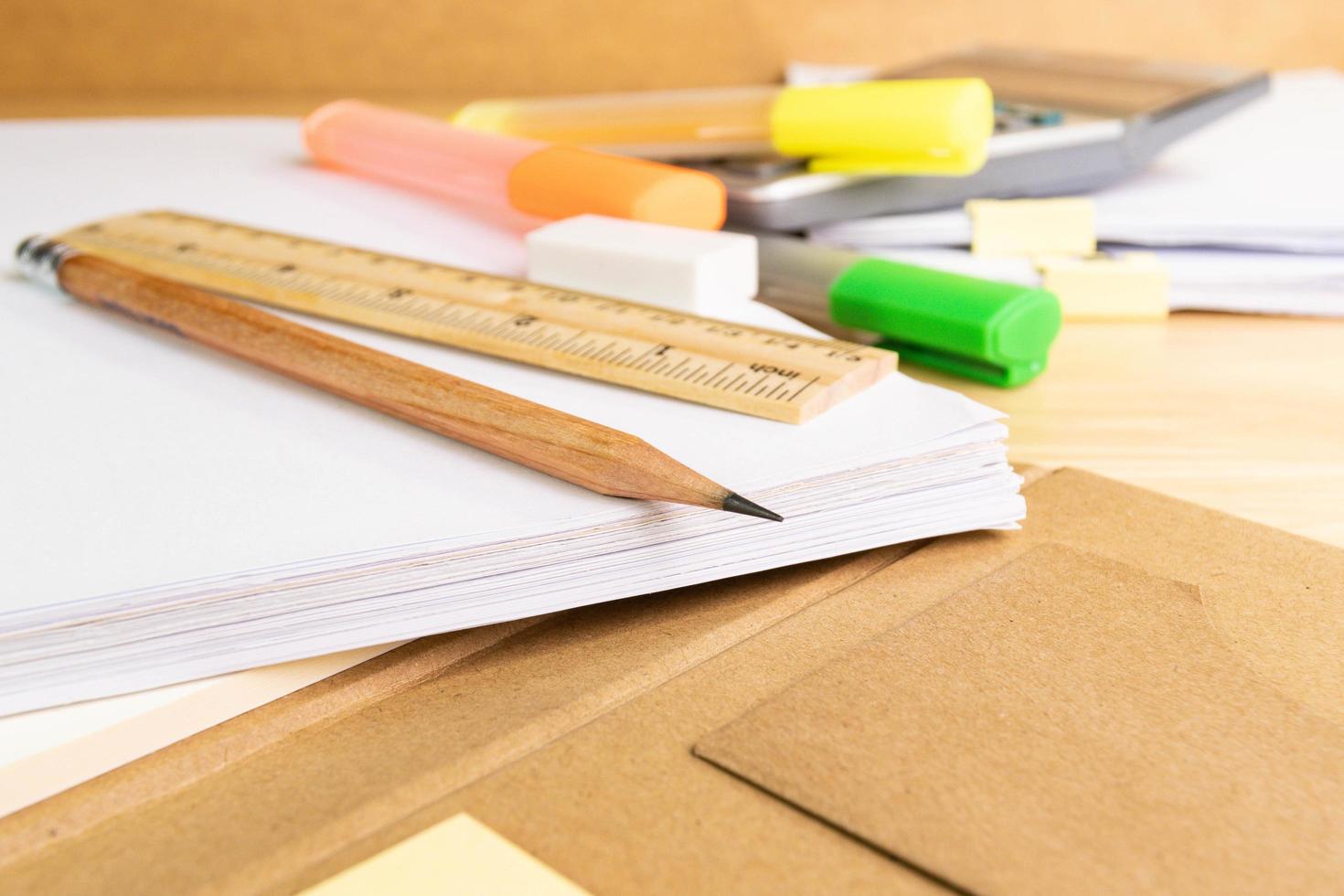 close up a pencil with equipment education background on a wood table photo