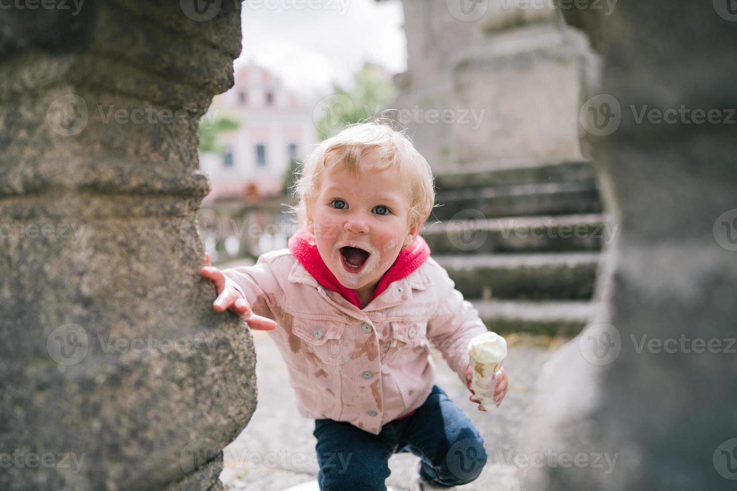 Little girl eating ice cream photo