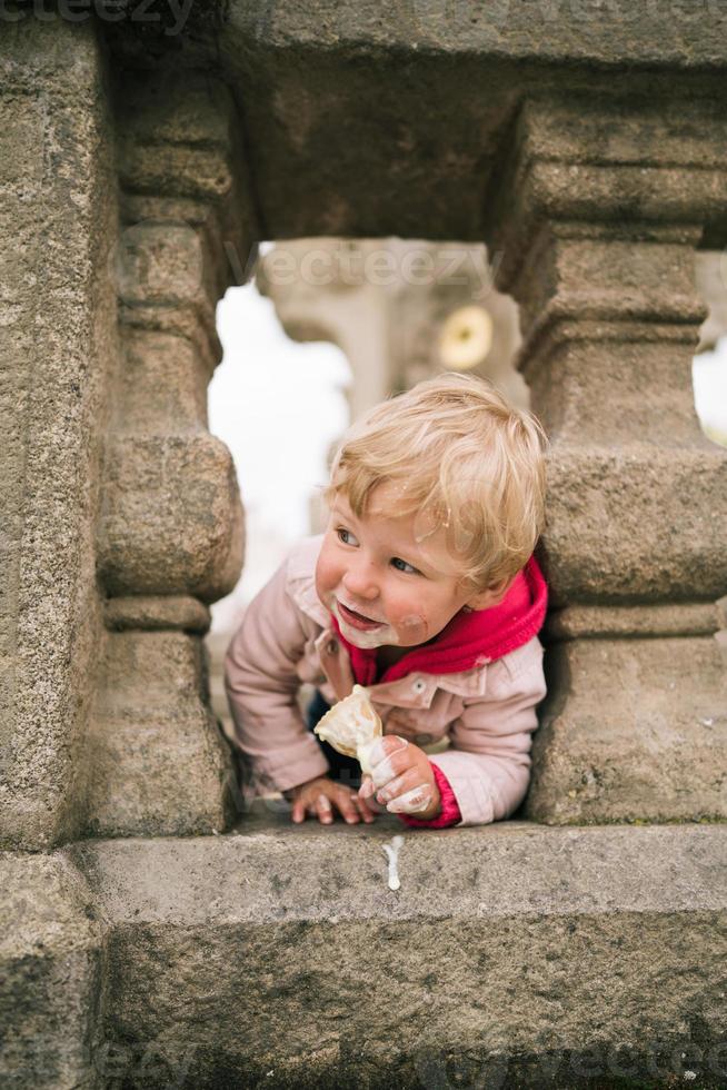 Little girl eating ice cream photo