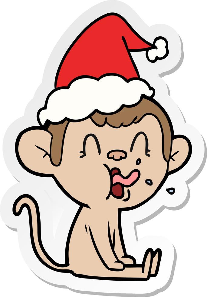 crazy sticker cartoon of a monkey sitting wearing santa hat vector