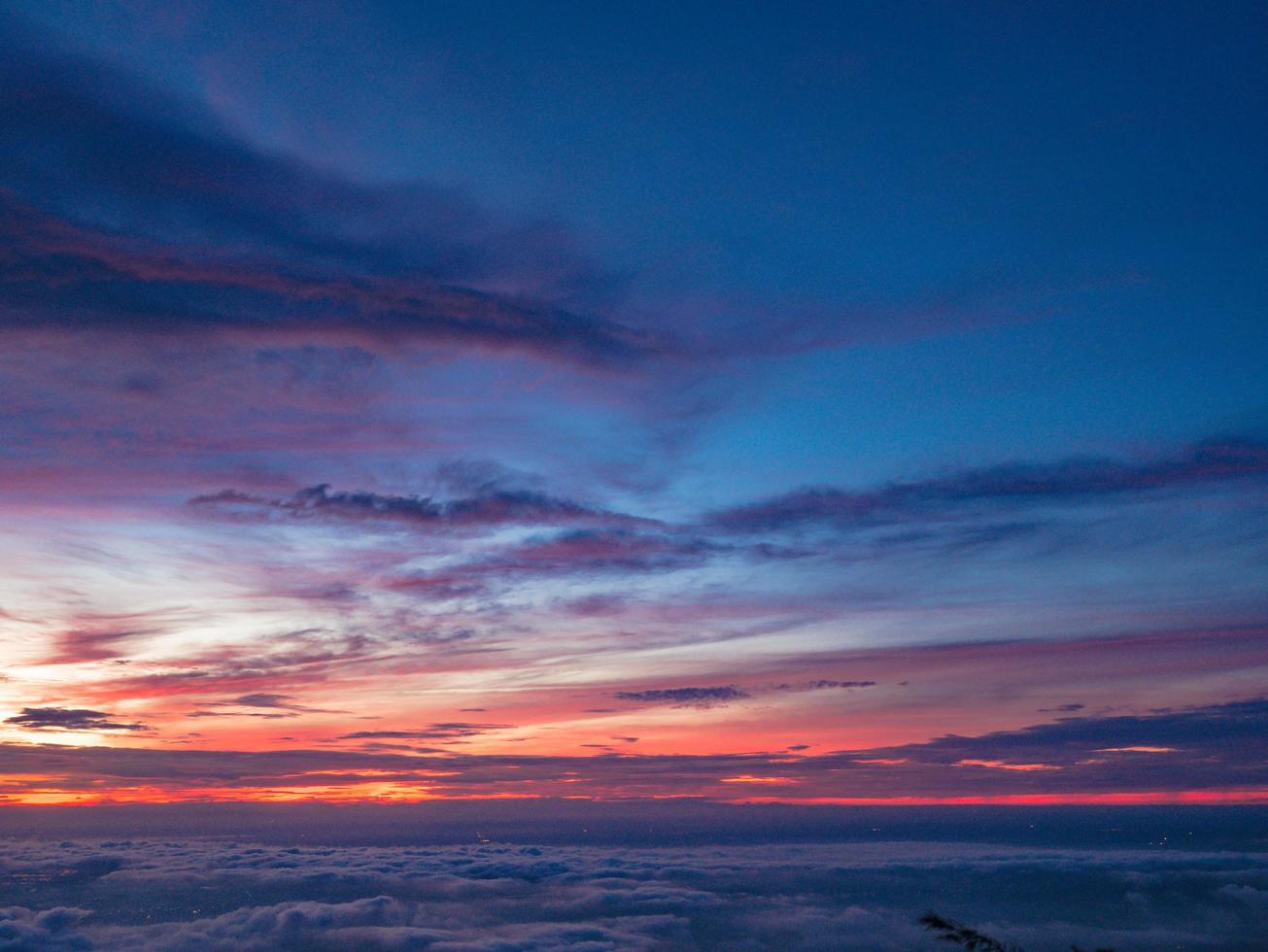 Beautiful Sunrise Sky with Sea of the mist of fog in the morning on Khao Luang mountain in Ramkhamhaeng National Park,Sukhothai province Thailand photo