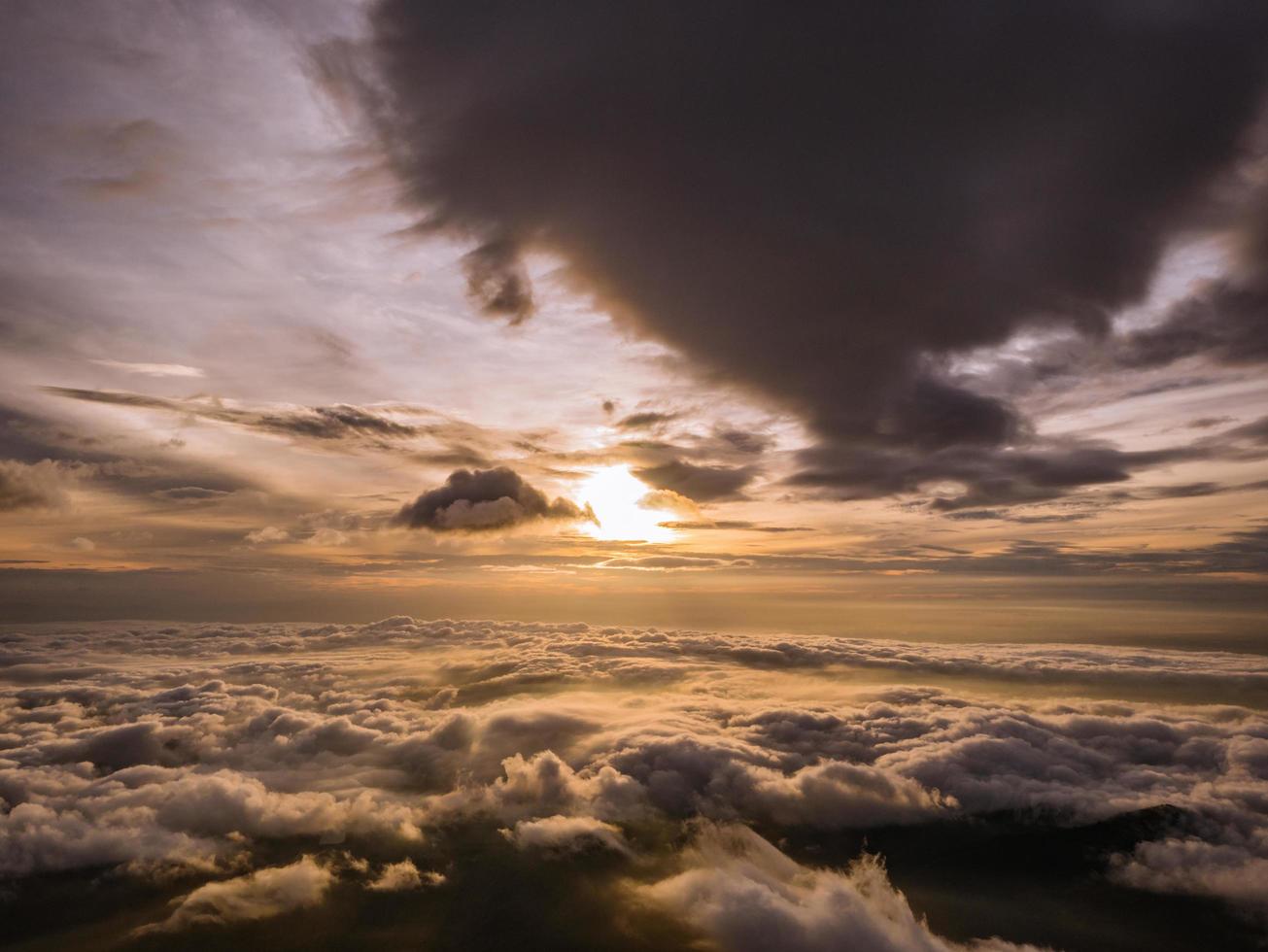 Beautiful Sunrise Sky with Sea of the mist of fog in the morning on Khao Luang mountain in Ramkhamhaeng National Park,Sukhothai province Thailand photo