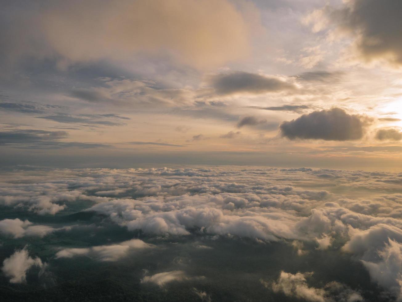 Beautiful Sunrise Sky with Sea of the mist of fog in the morning on Khao Luang mountain in Ramkhamhaeng National Park,Sukhothai province Thailand photo