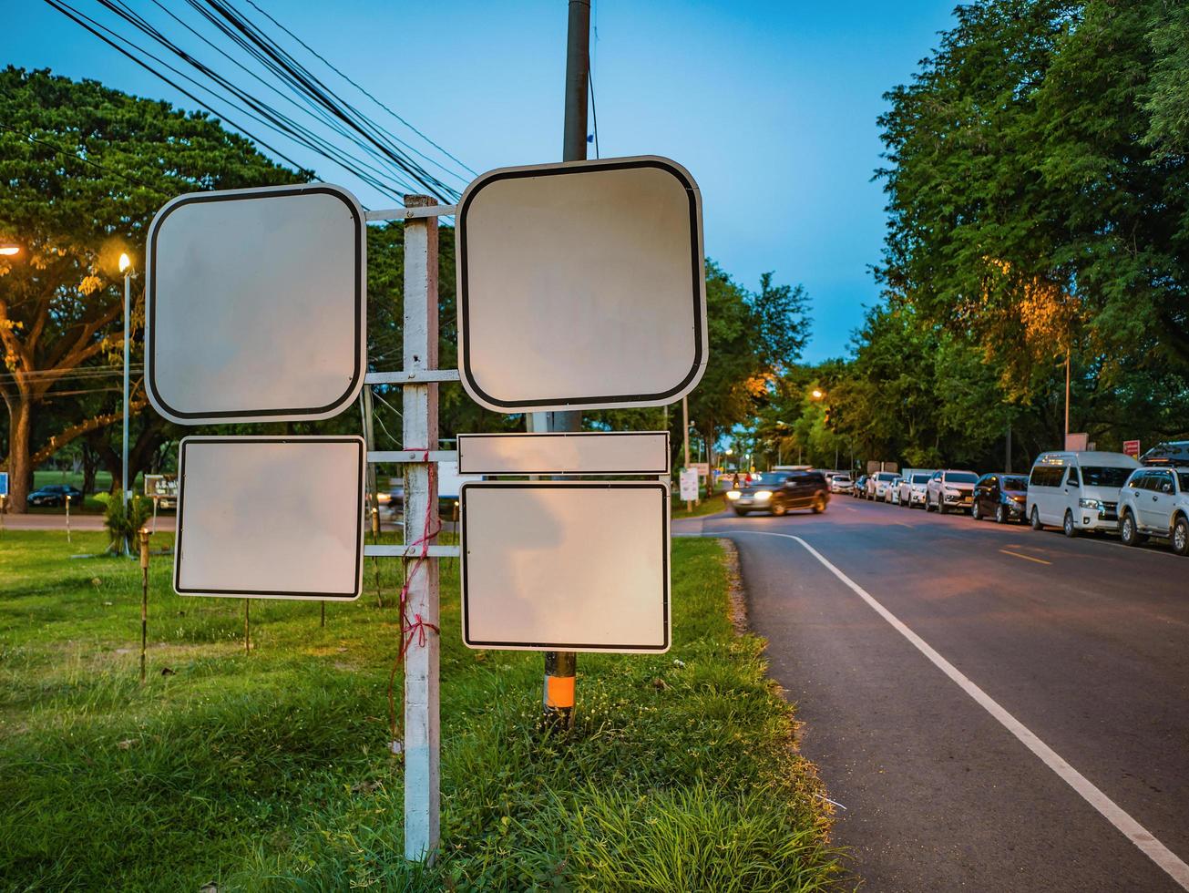 Mock up white Traffic Sign Beside the Road photo