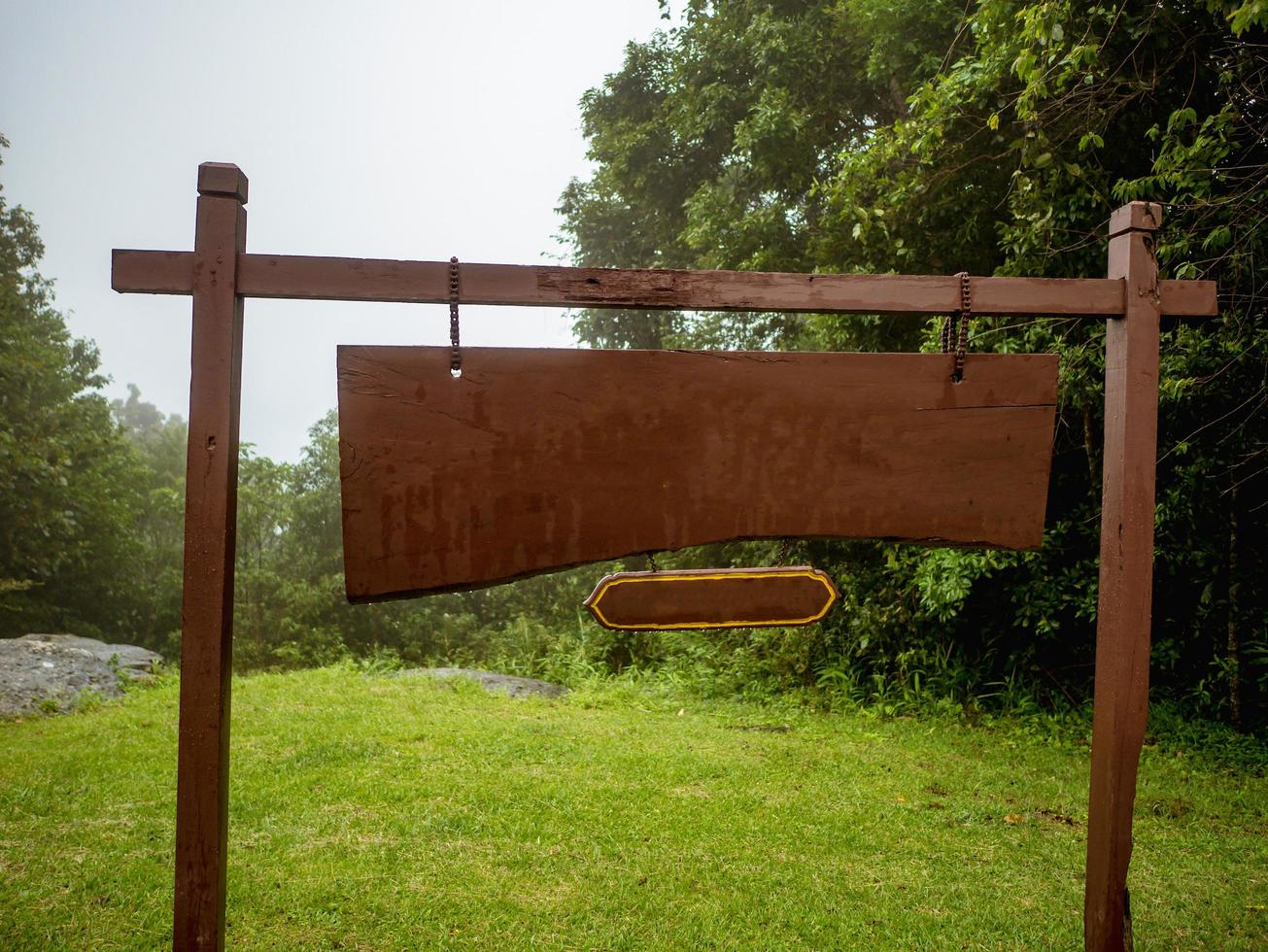 Wooden Banner on the mountain in Foggy day photo