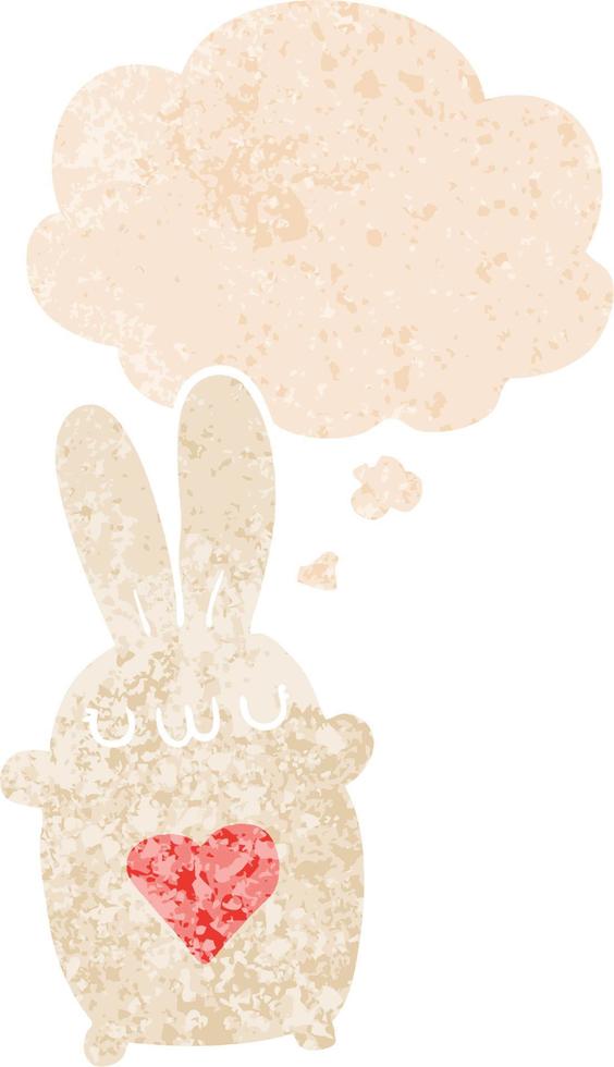 cute cartoon rabbit with love heart and thought bubble in retro textured style vector