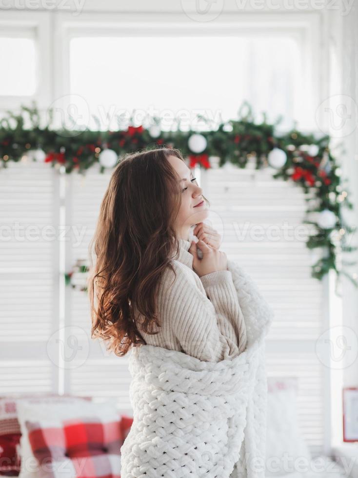 woman in warm knitted clothes photo