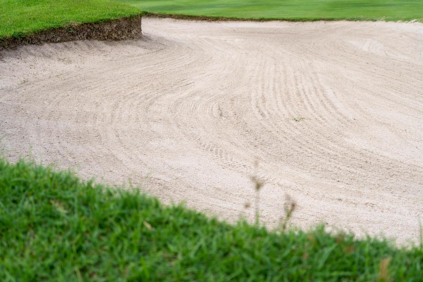 sandpit bunker beauty background is Used as an obstacle for golf tournaments for difficulty. and decorate the field for beauty.green grass with sand texture. photo