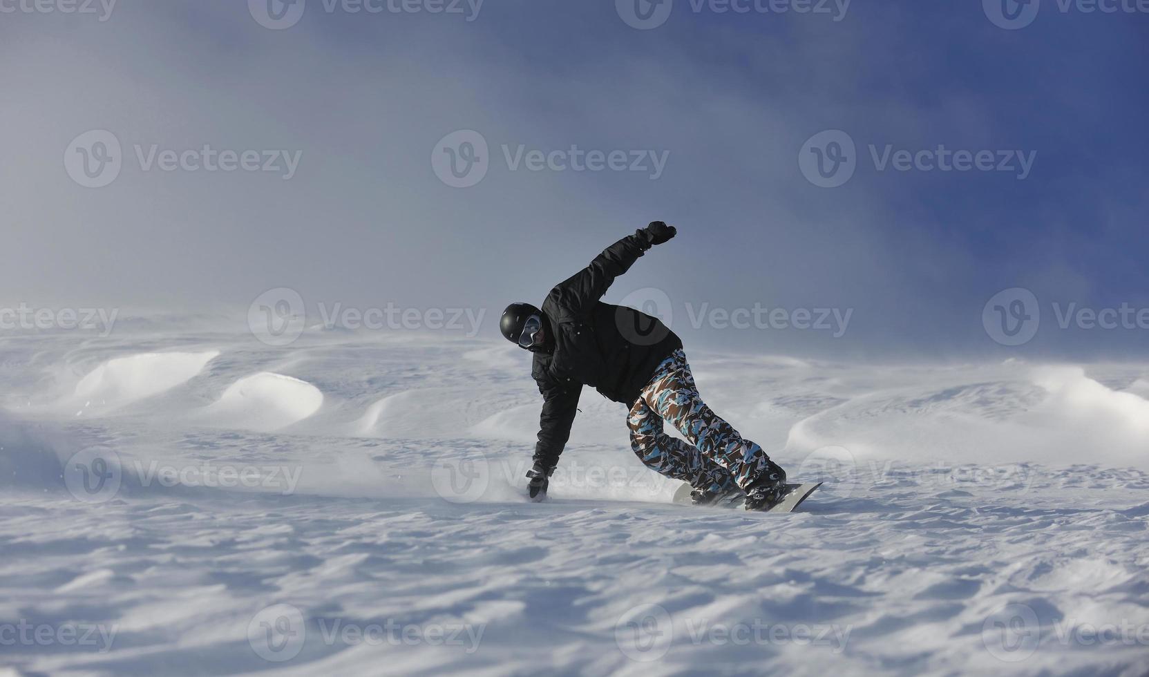 freestyle snowboarder jump and ride photo