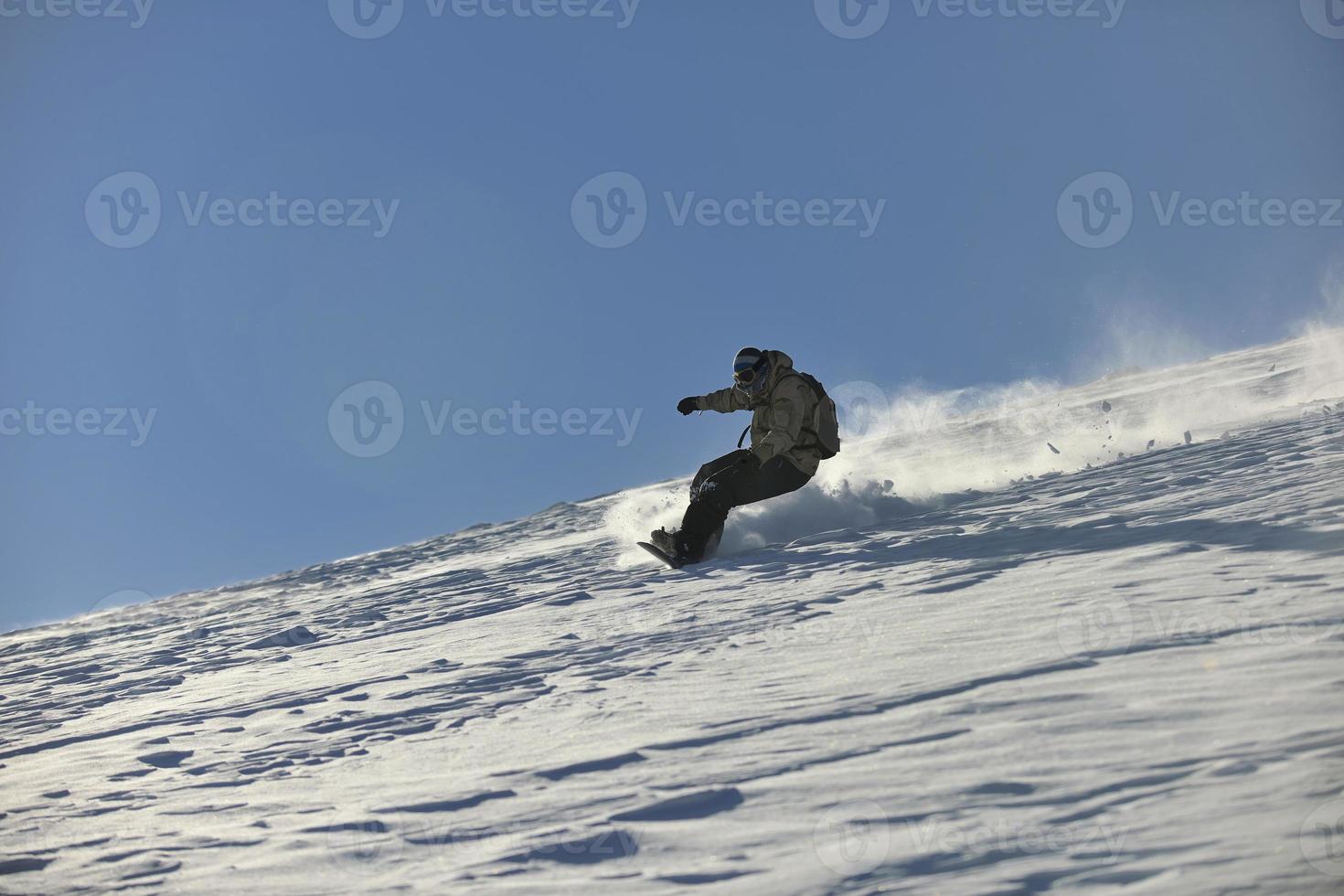 freestyle snowboarder jump and ride photo