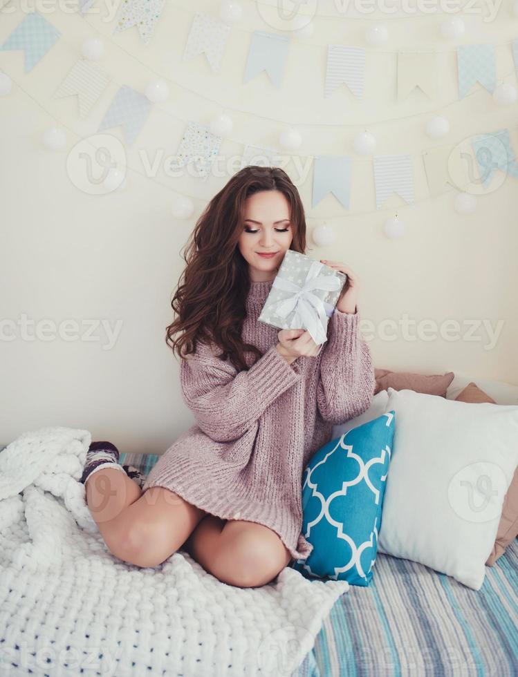 beautiful woman with gifts photo