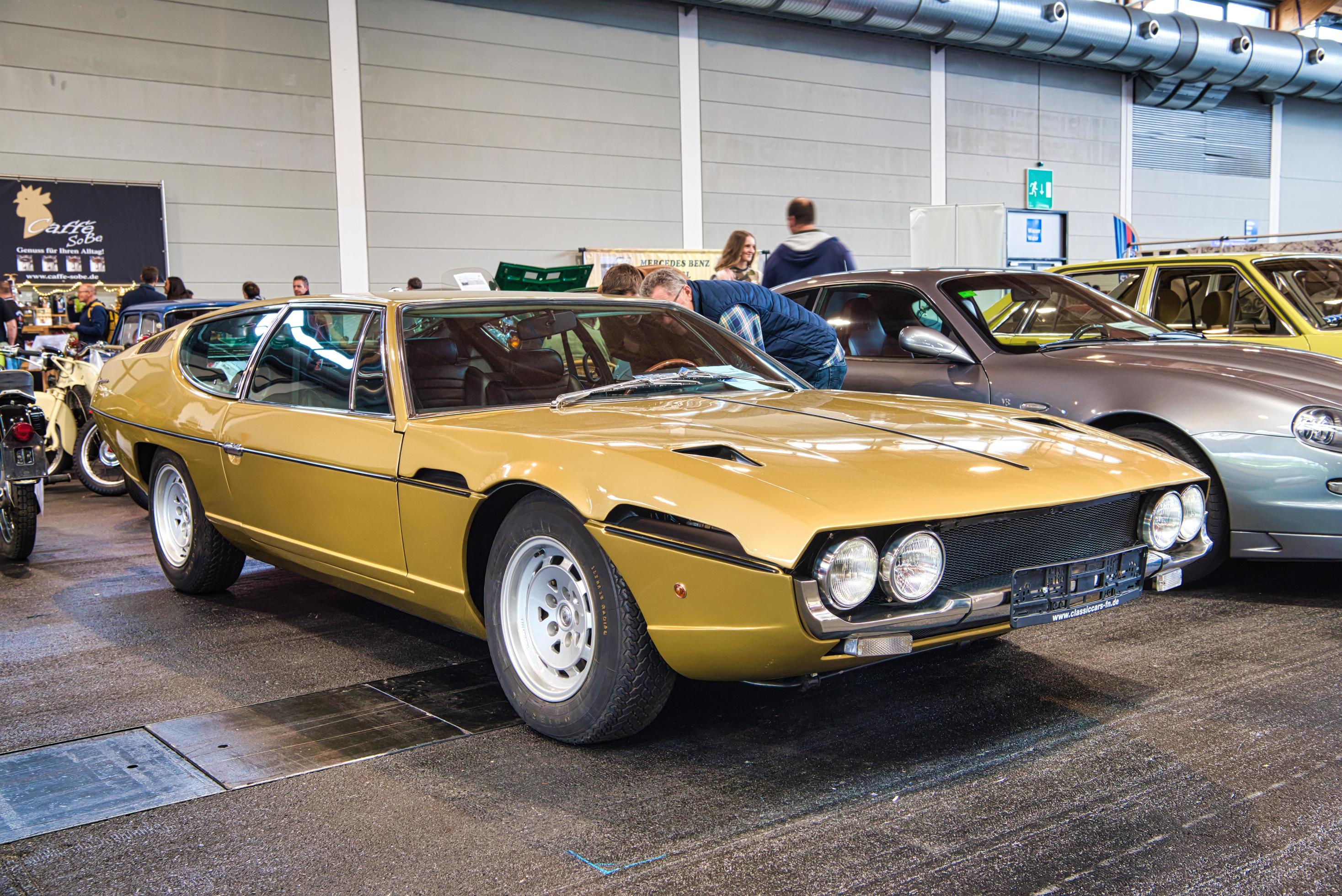 FRIEDRICHSHAFEN - MAY 2019 sand golden LAMBORGHINI ESPADA 400 GT 1972 coupe  at Motorworld Classics Bodensee on May 11, 2019 in Friedrichshafen, Germany  10643492 Stock Photo at Vecteezy