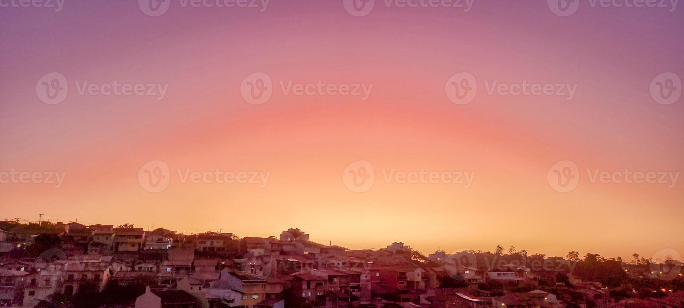 colorful late afternoon sunset in the countryside of Brazil photo