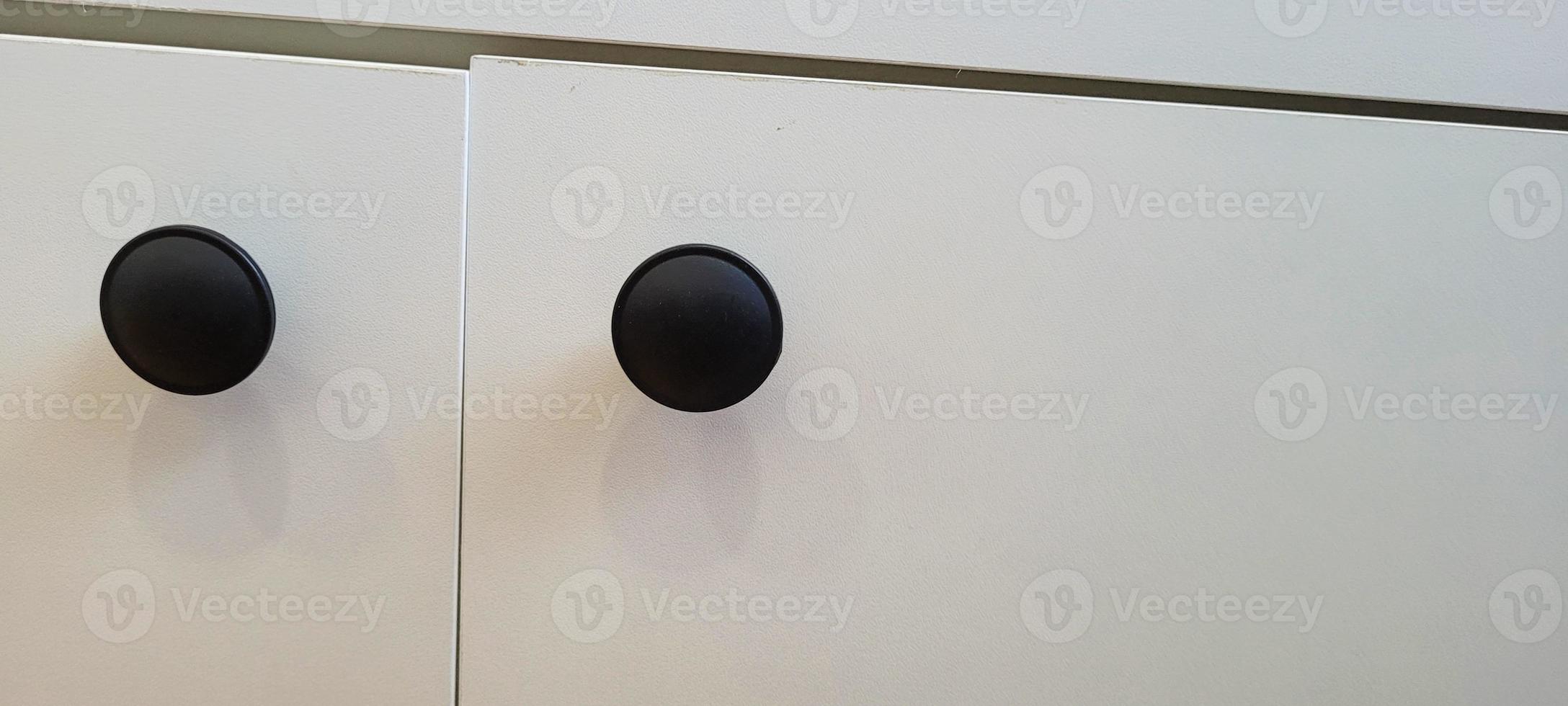 white furniture with black metal handle for 10643953 Stock Photo at