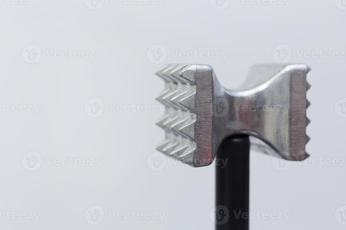 steel meat hammer close up image on white background studio light. photo