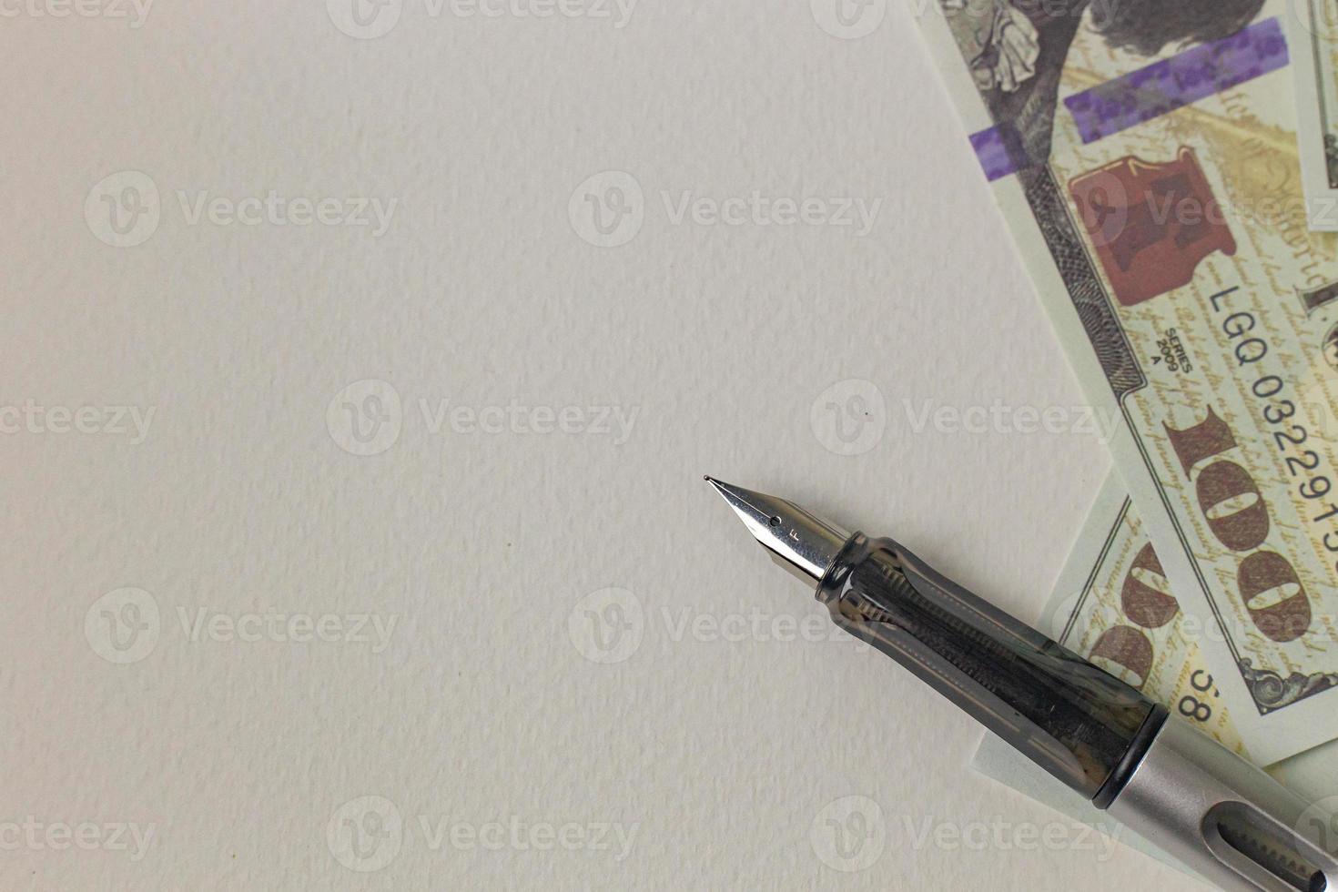 pen and banknotes image for business concept. photo