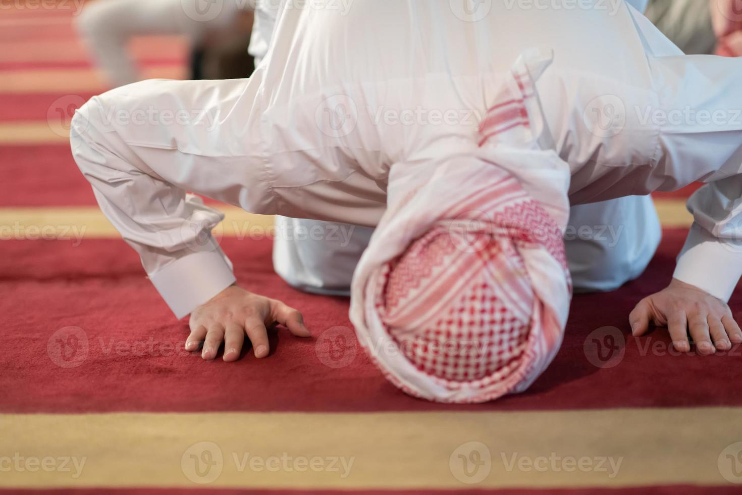 man performing sajdah in namaz photo