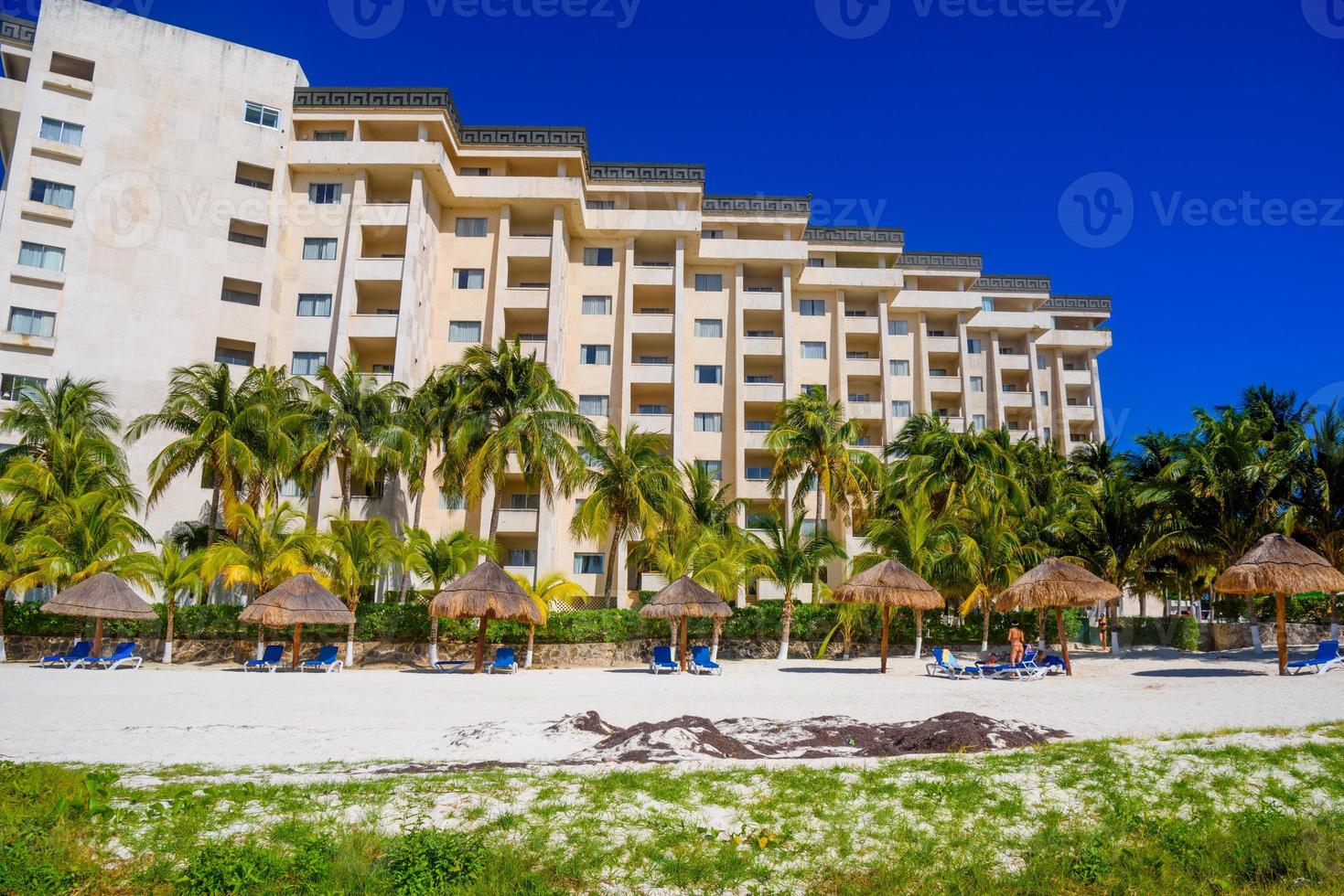 Hotel on the sandy beach on a sunny day in Cancun, Yukatan, Mexico photo