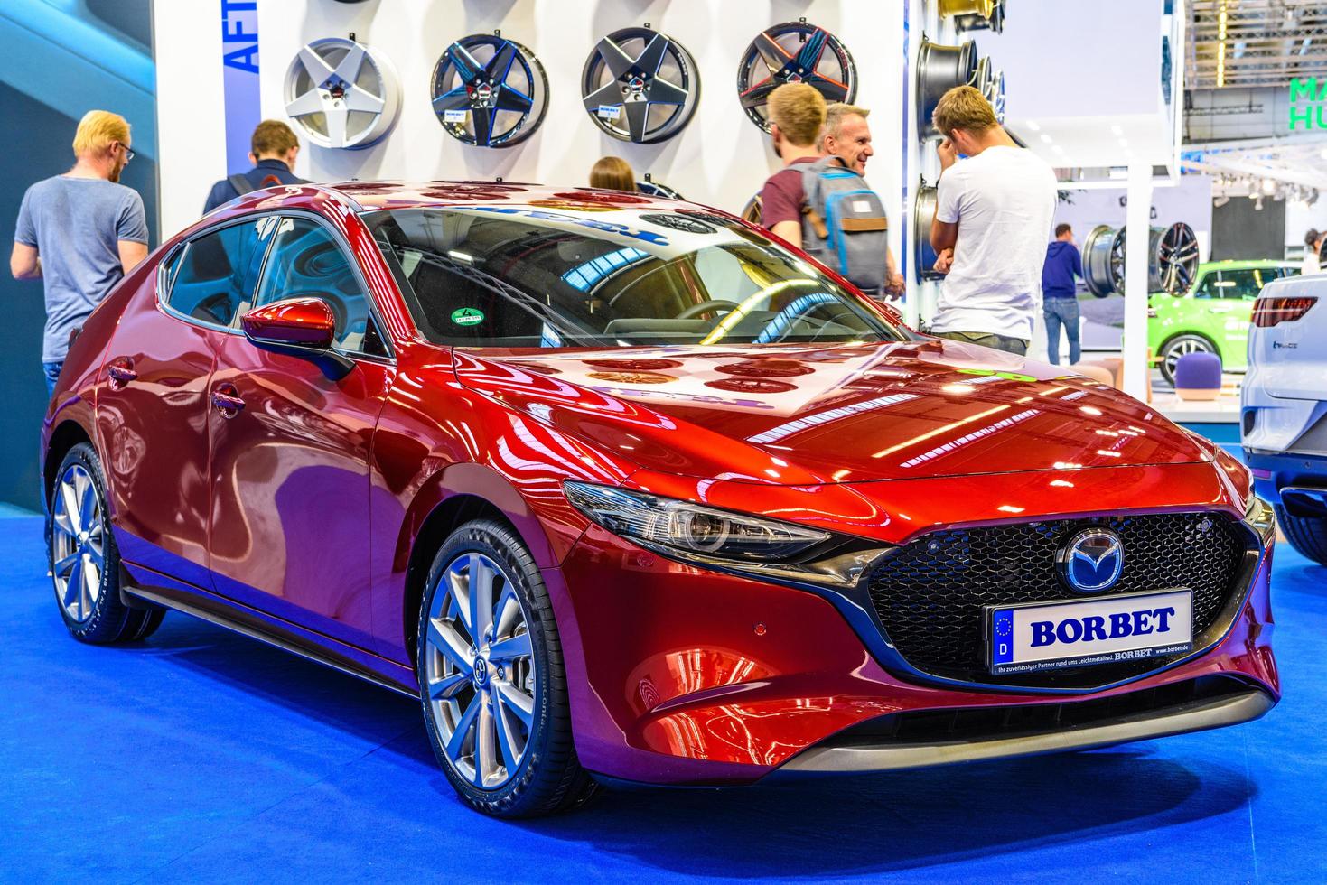 FRANKFURT, GERMANY - SEPT 2019 red MAZDA 3 Borbet 4th generation BP hatchback, IAA International Motor Show Auto Exhibtion photo