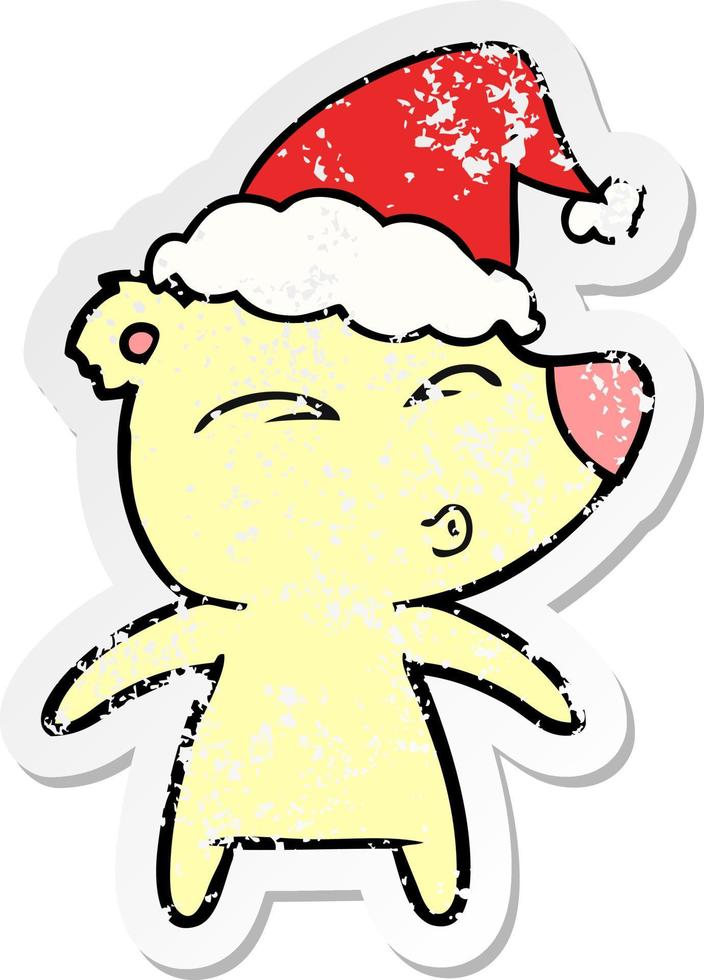 distressed sticker cartoon of a whistling bear wearing santa hat vector