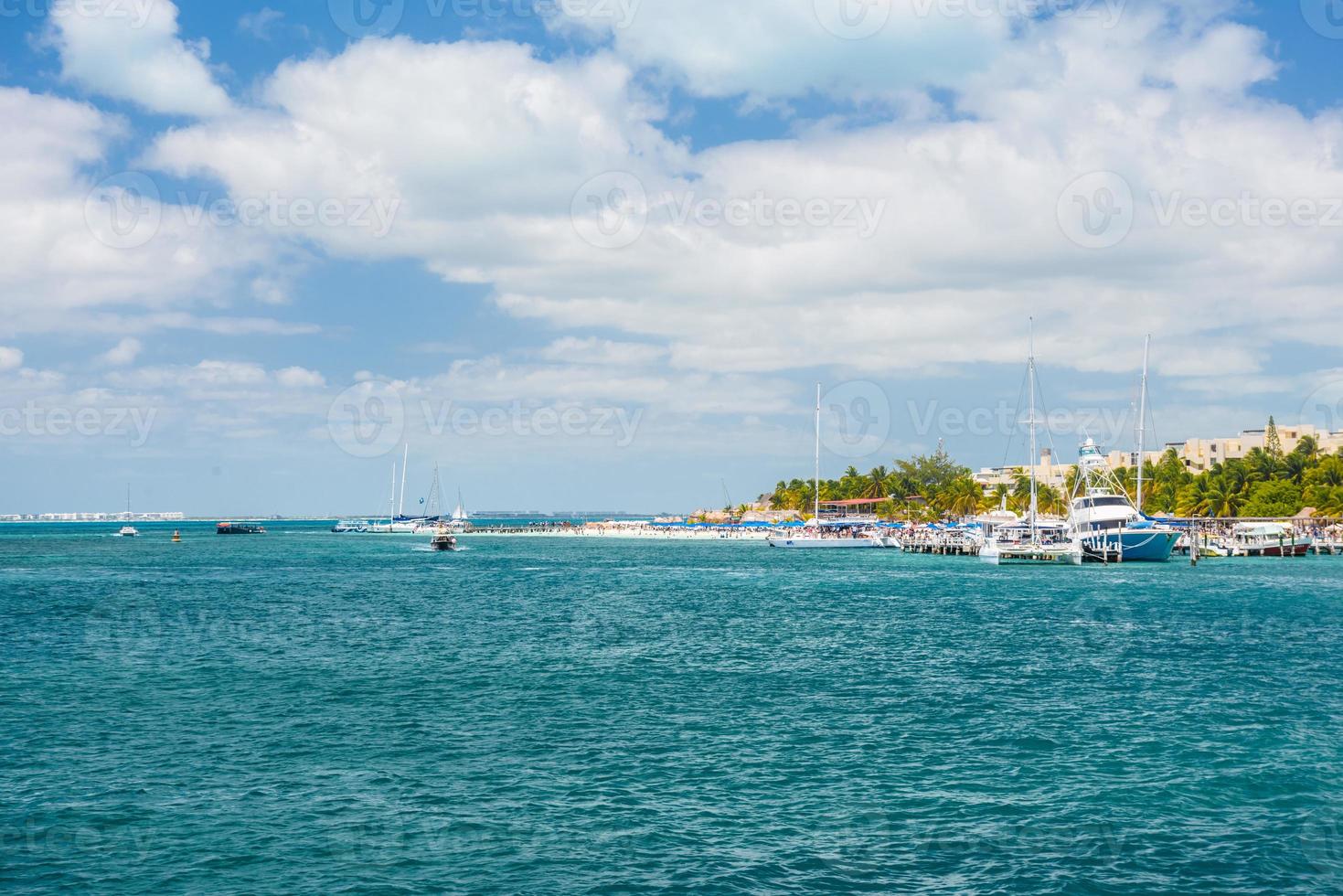 Port with sailboats and ships in Isla Mujeres island in Caribbean Sea, Cancun, Yucatan, Mexico photo