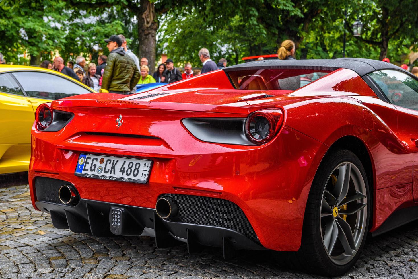 GERMANY, FULDA - JUL 2019 rearview lights of red FERRARI 488 SPIDER Type F142M coupe is a mid-engine sports car produced by the Italian automobile manufacturer Ferrari. The car is an update to the 458 photo