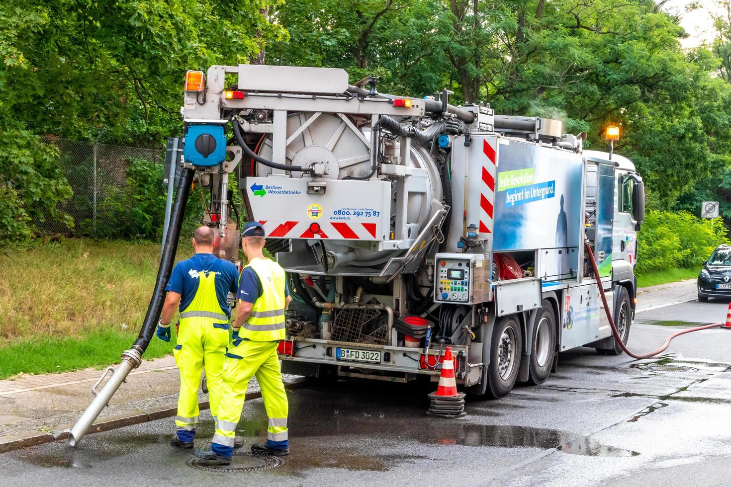 Sewer cleaning with persons photo