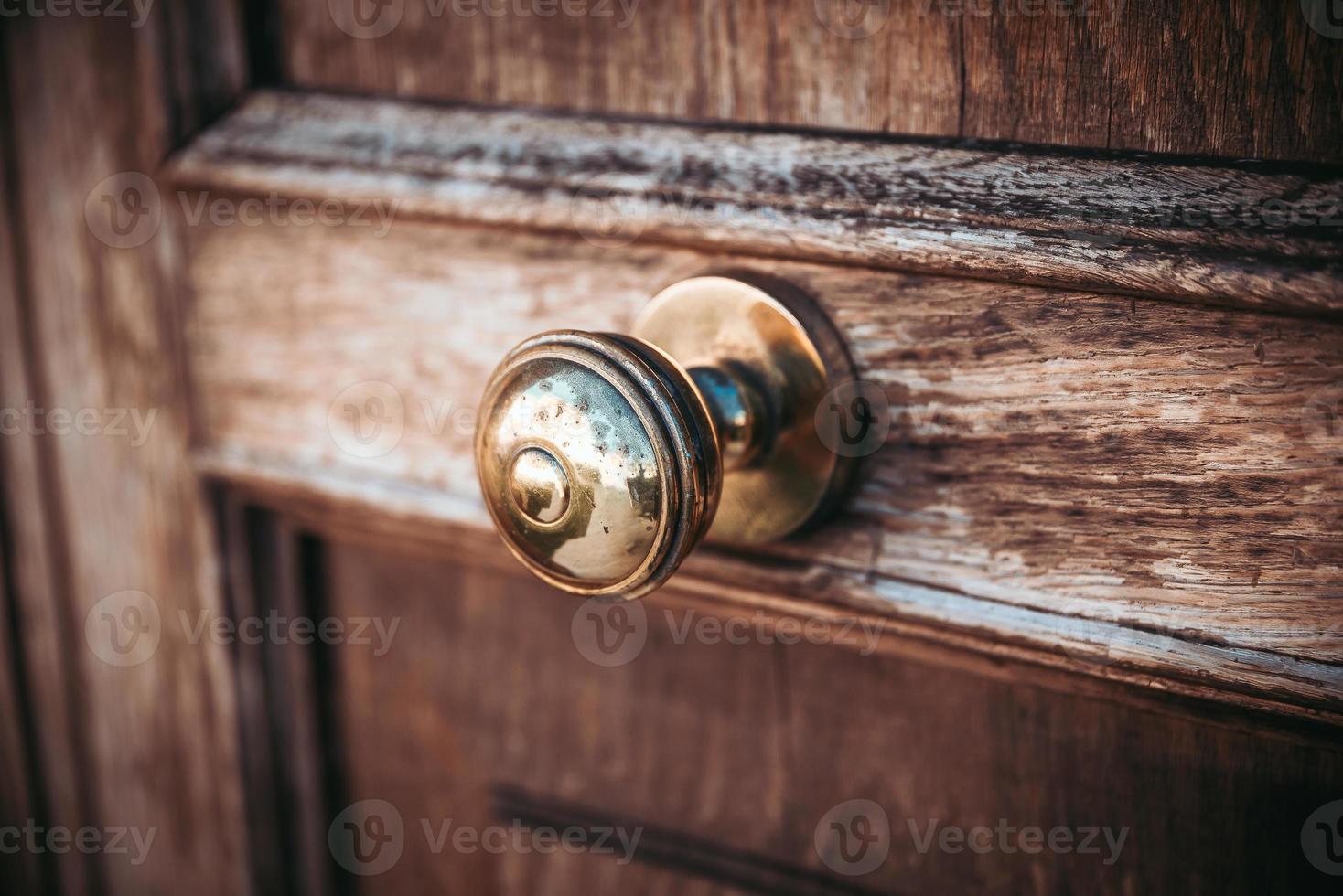 Old doorknob on a front door photo