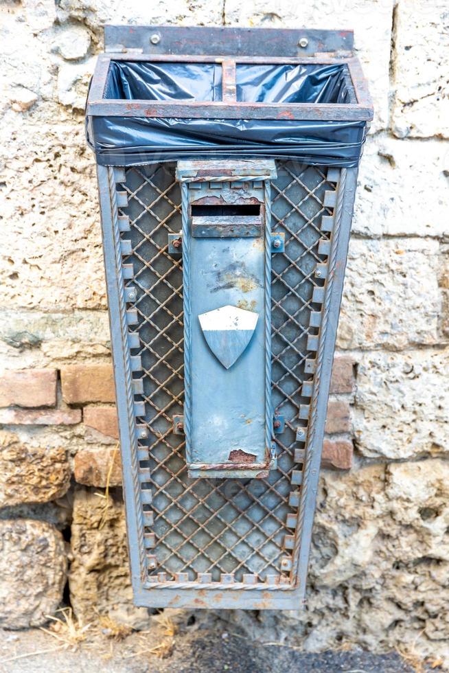 A nostalgic trash can on a wall photo