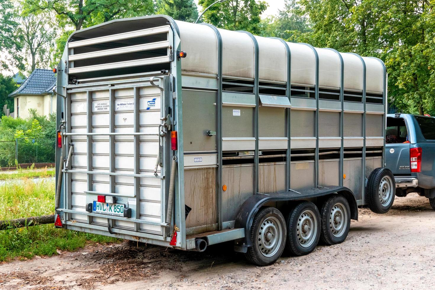 horse trailer with three axles from behind photo