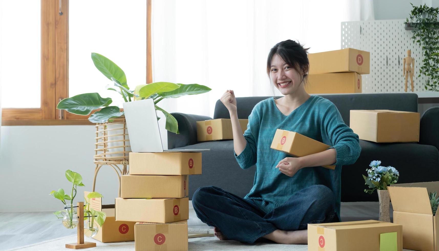 Portrait of Starting small businesses SME owners female entrepreneurs working on receipt box and check online orders to prepare to pack the boxes, sell to customers, SME business ideas online. photo
