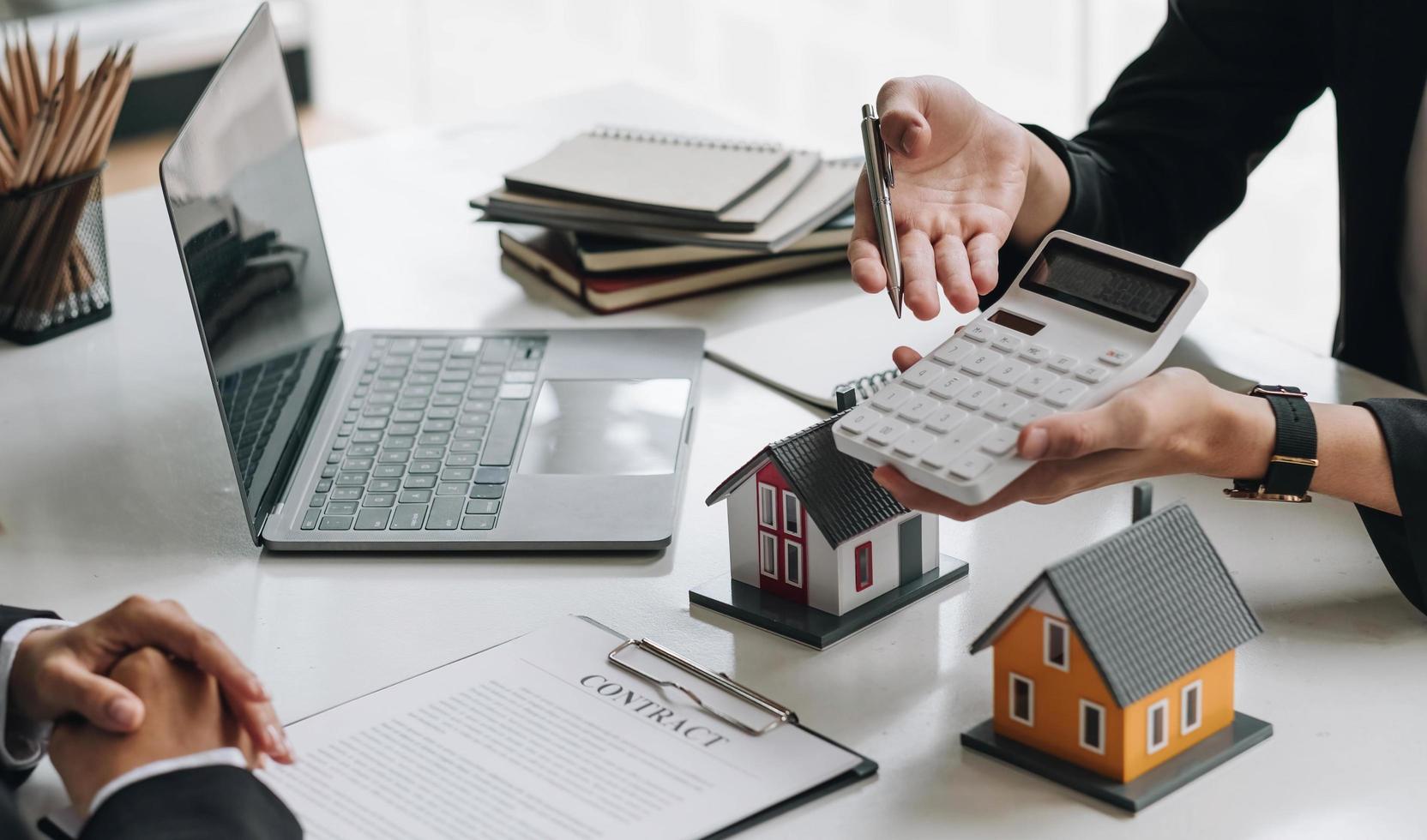Real estate broker agent talk reach contract form presenting and consult to customer to decision making sign insurance form agreement with approved mortgage application form insurance. photo