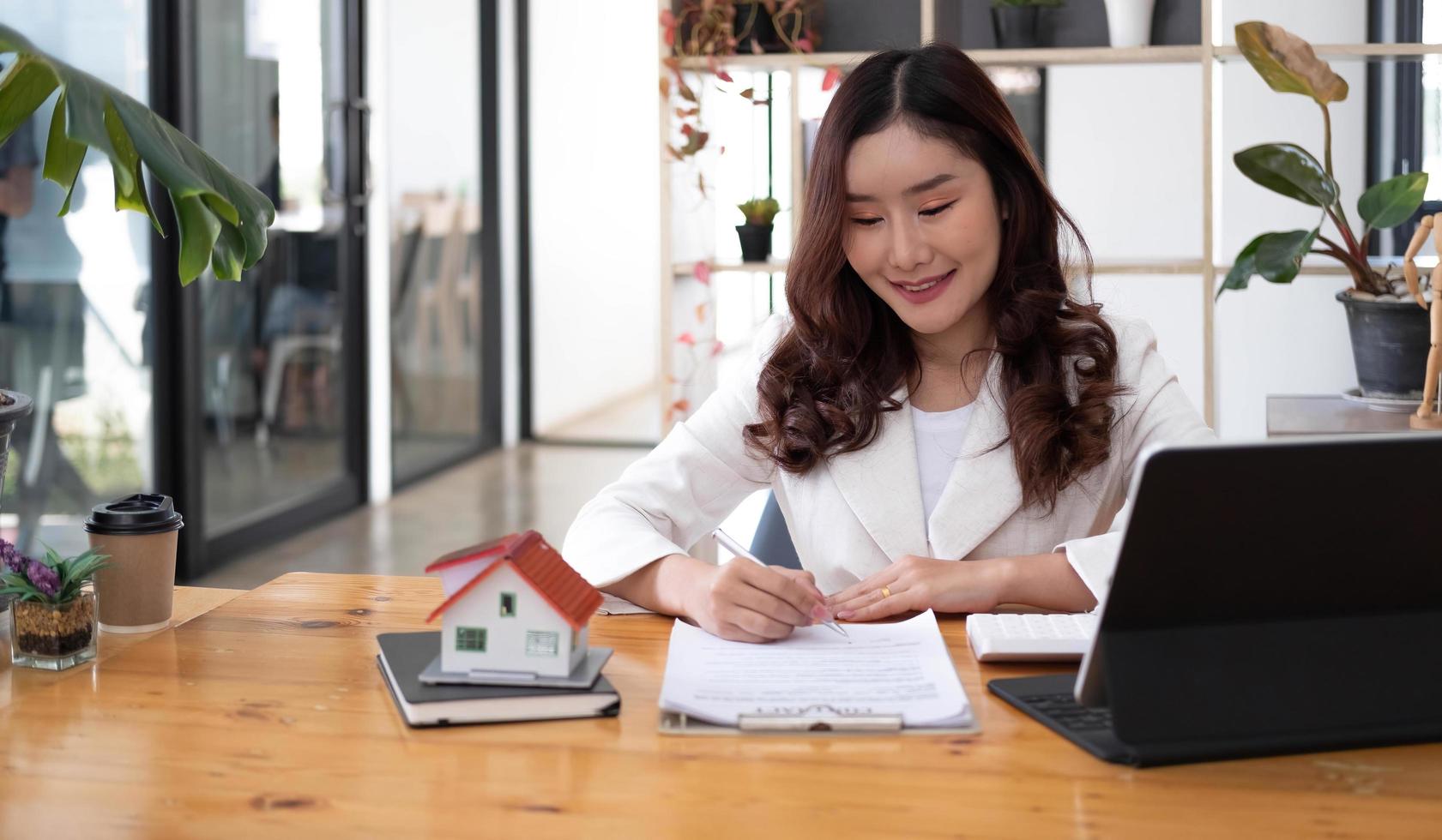 Real estate agent offer house design and contract. Approval of a contract to buy or sell a home. Offers mortgage loans and home insurance concept. photo