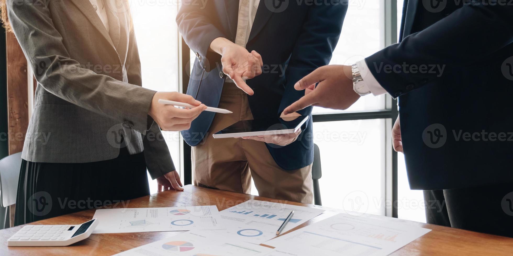 Business team analyzing income charts and graphs with modern laptop computer. Close up.Business analysis and strategy concept. photo