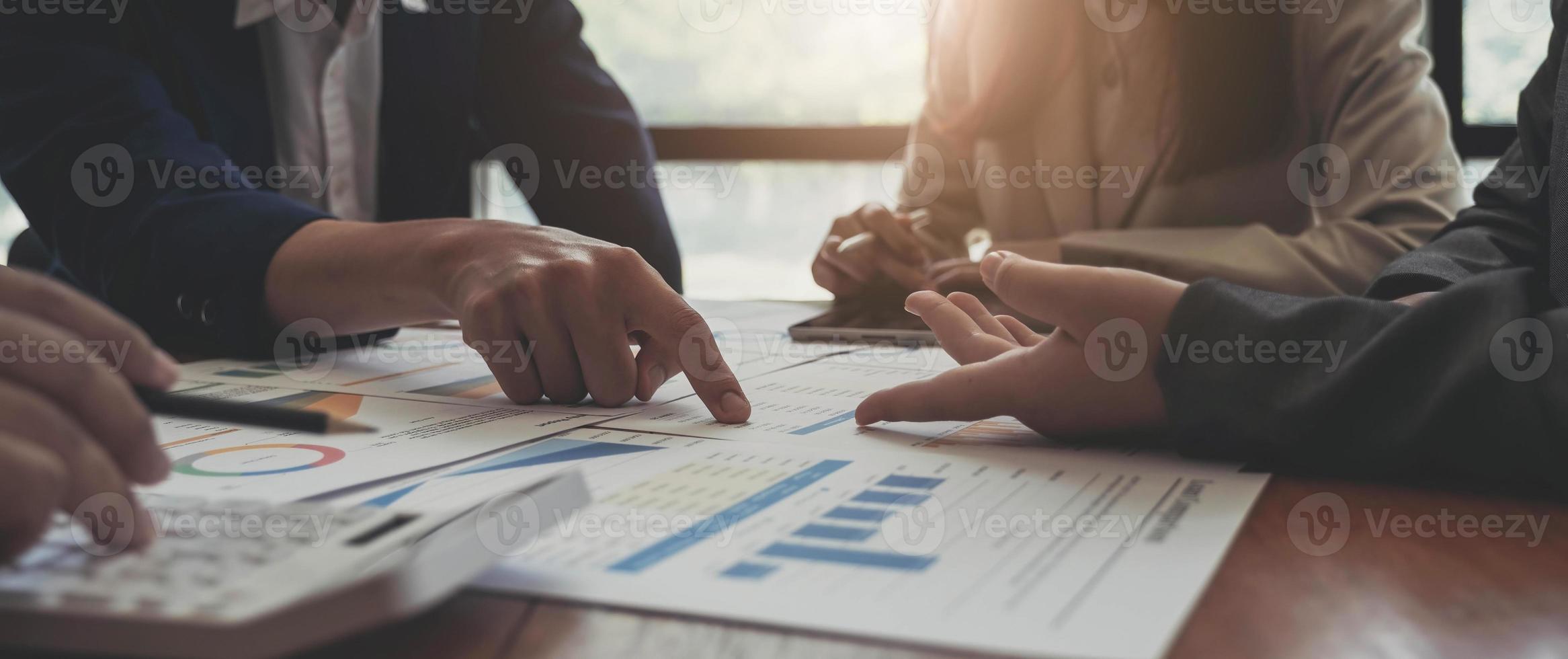 Business team analyzing income charts and graphs with modern laptop computer. Close up.Business analysis and strategy concept. photo