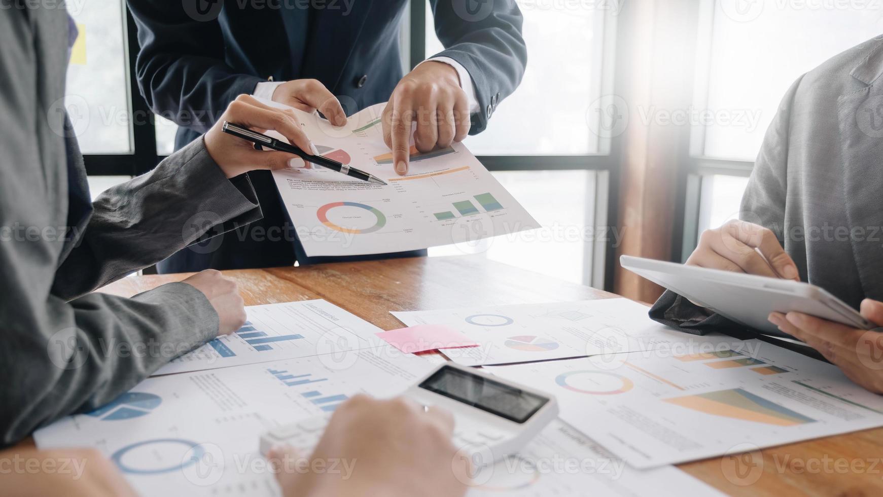 Team of business people working together in the meeting room office, teamwork background charts and graphs banner, double exposure successful teamwork,business planning concept. photo