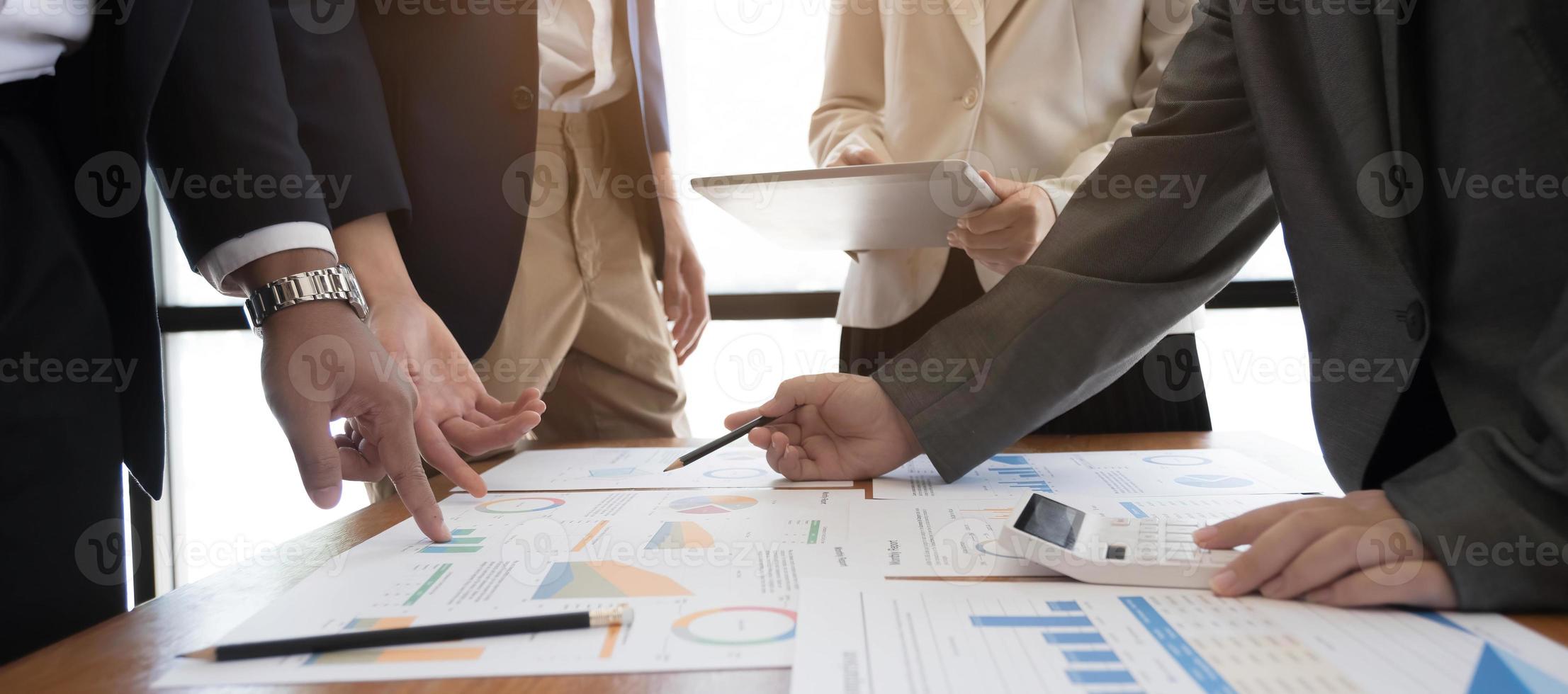 Asian business adviser meeting to analyze and discuss the situation on the financial report in the meeting room.Investment Consultant,Financial Consultant,Financial advisor and accounting concept photo