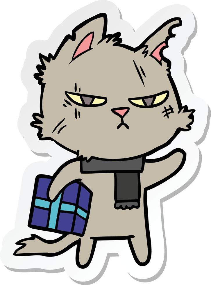 sticker of a tough cartoon cat with christmas present vector