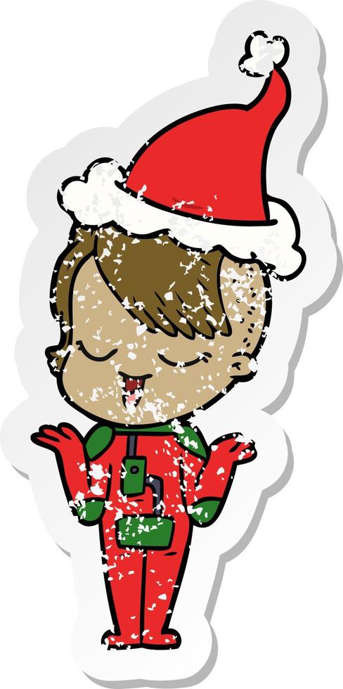 happy distressed sticker cartoon of a girl in space suit wearing santa hat vector