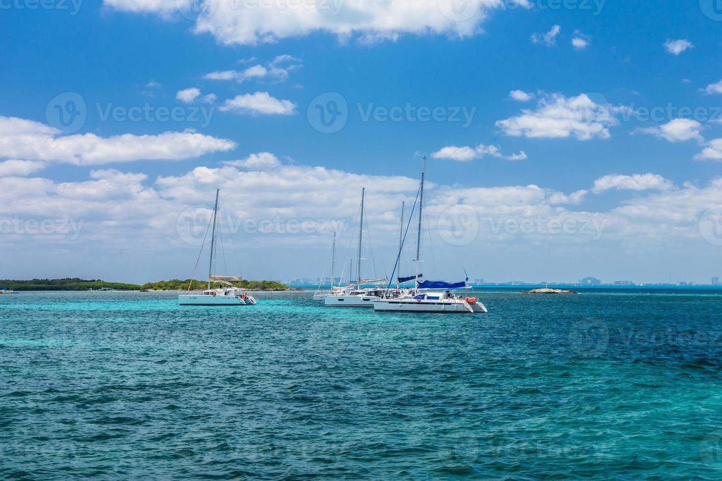 Sailboat and turquoise clear water, blue water, Caribbean ocean, Isla Mujeres, Cancun, Yucatan, Mexico photo