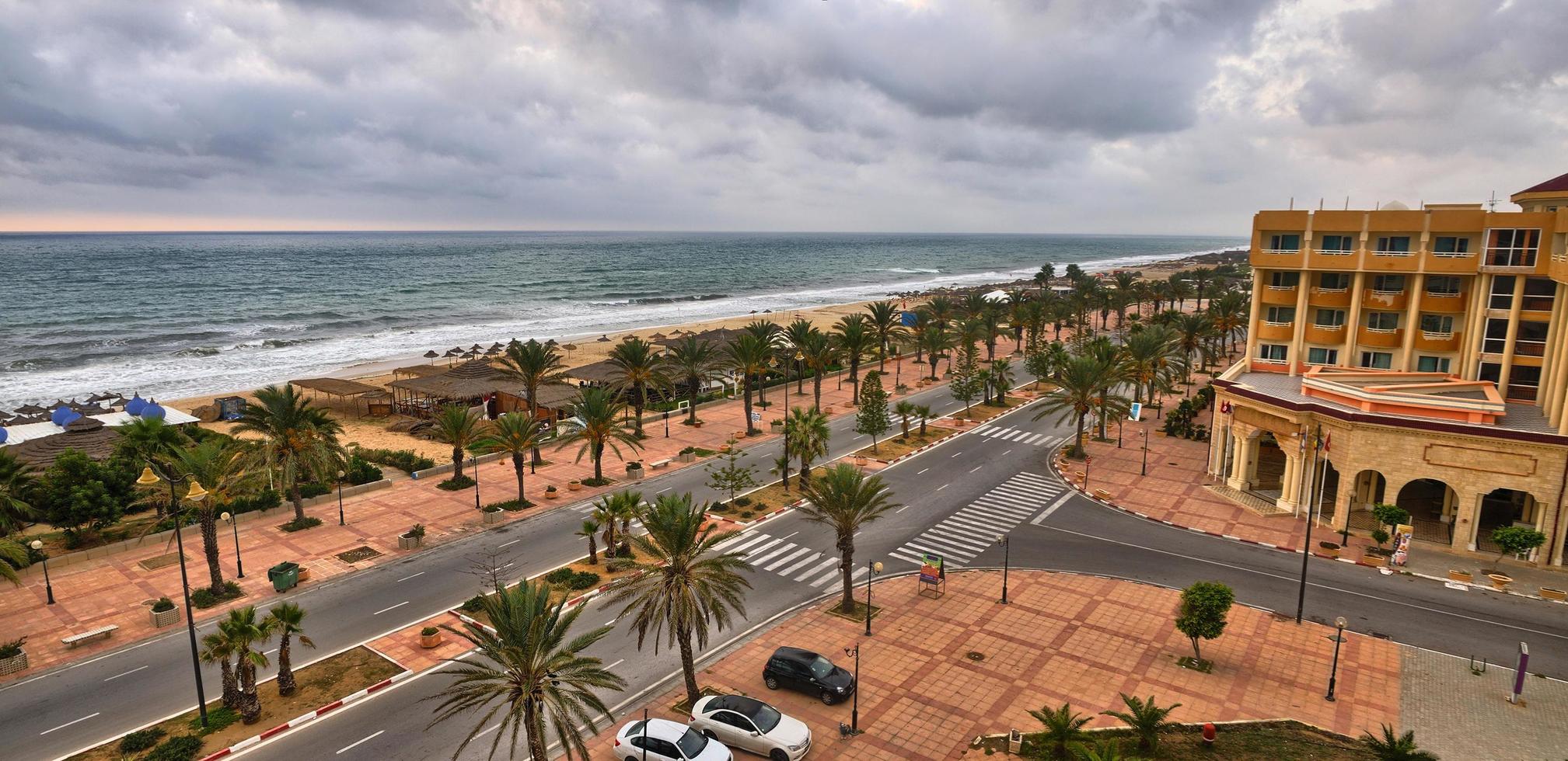 HAMMAMET, TUNISIA - OCT 2014 Palms alley near beachl on October photo