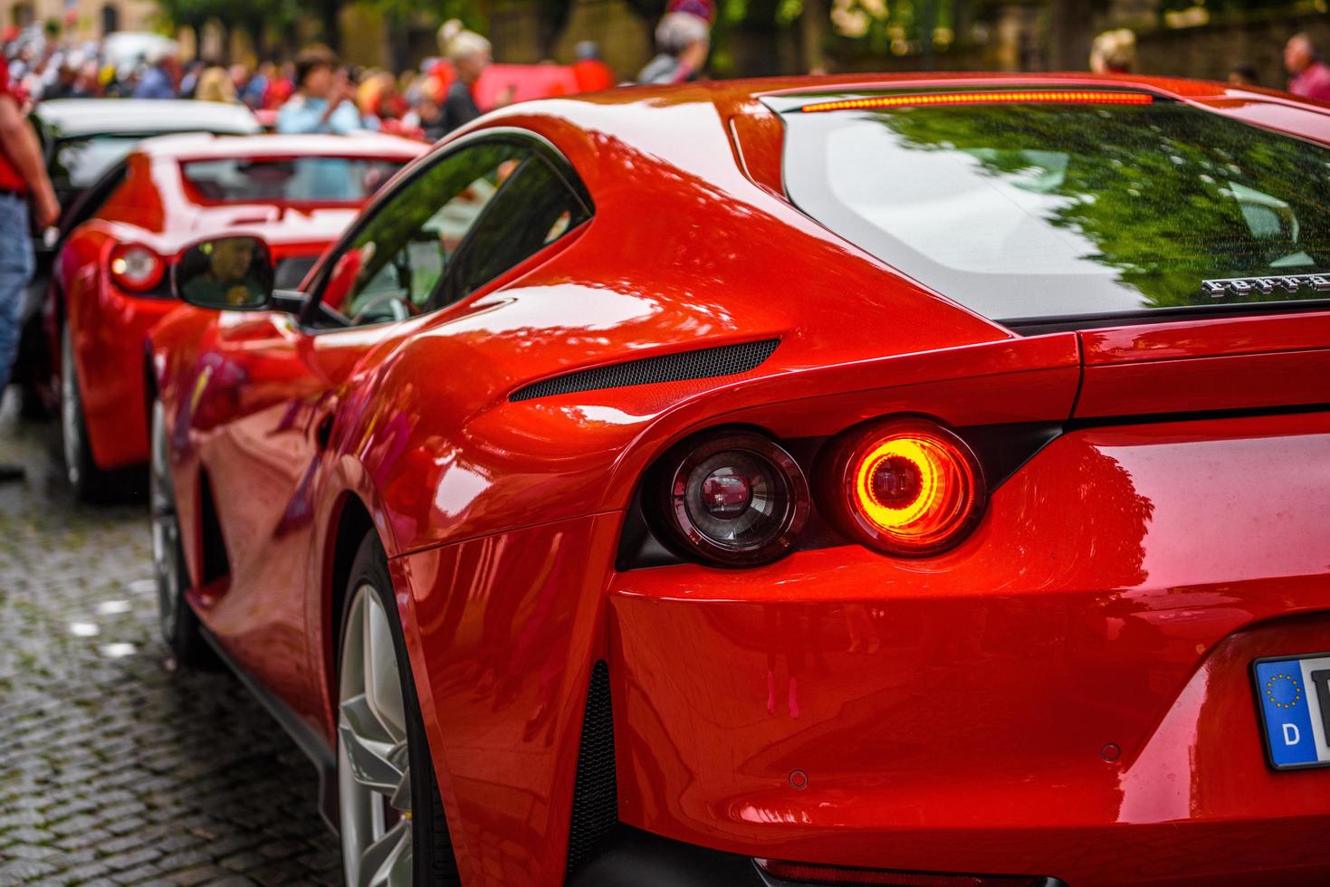 GERMANY, FULDA - JUL 2019 red FERRARI 812 SUPERFAST Type F152M is a front mid-engine, rear-wheel-drive grand tourer produced by Italian sports car manufacturer Ferrari that made its debut at the 2017 photo