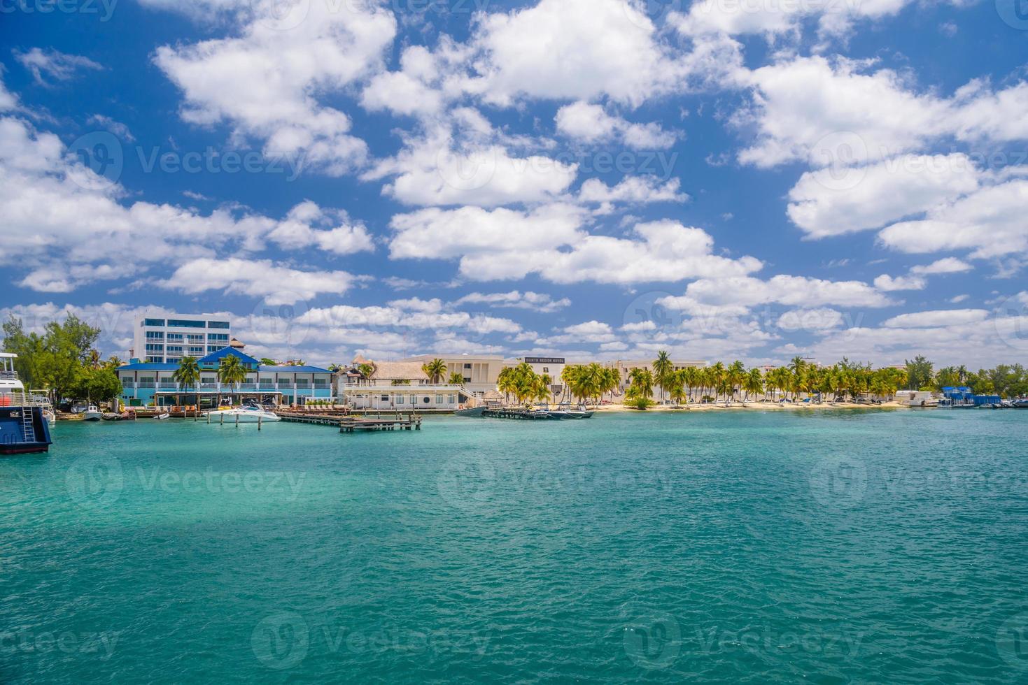 Port with sailboats and ships in Isla Mujeres island in Caribbean Sea, Cancun, Yucatan, Mexico photo