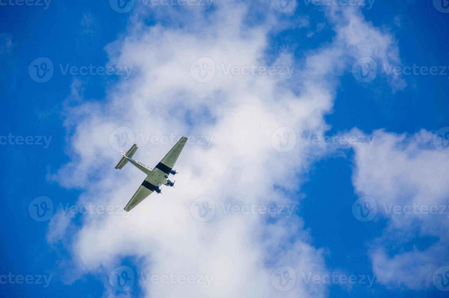 American military transport plane on the blue sky, Germany photo