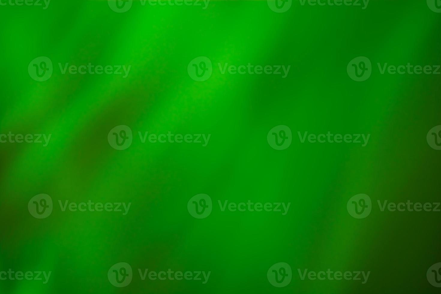 Abstract wavy background in shades of green photo