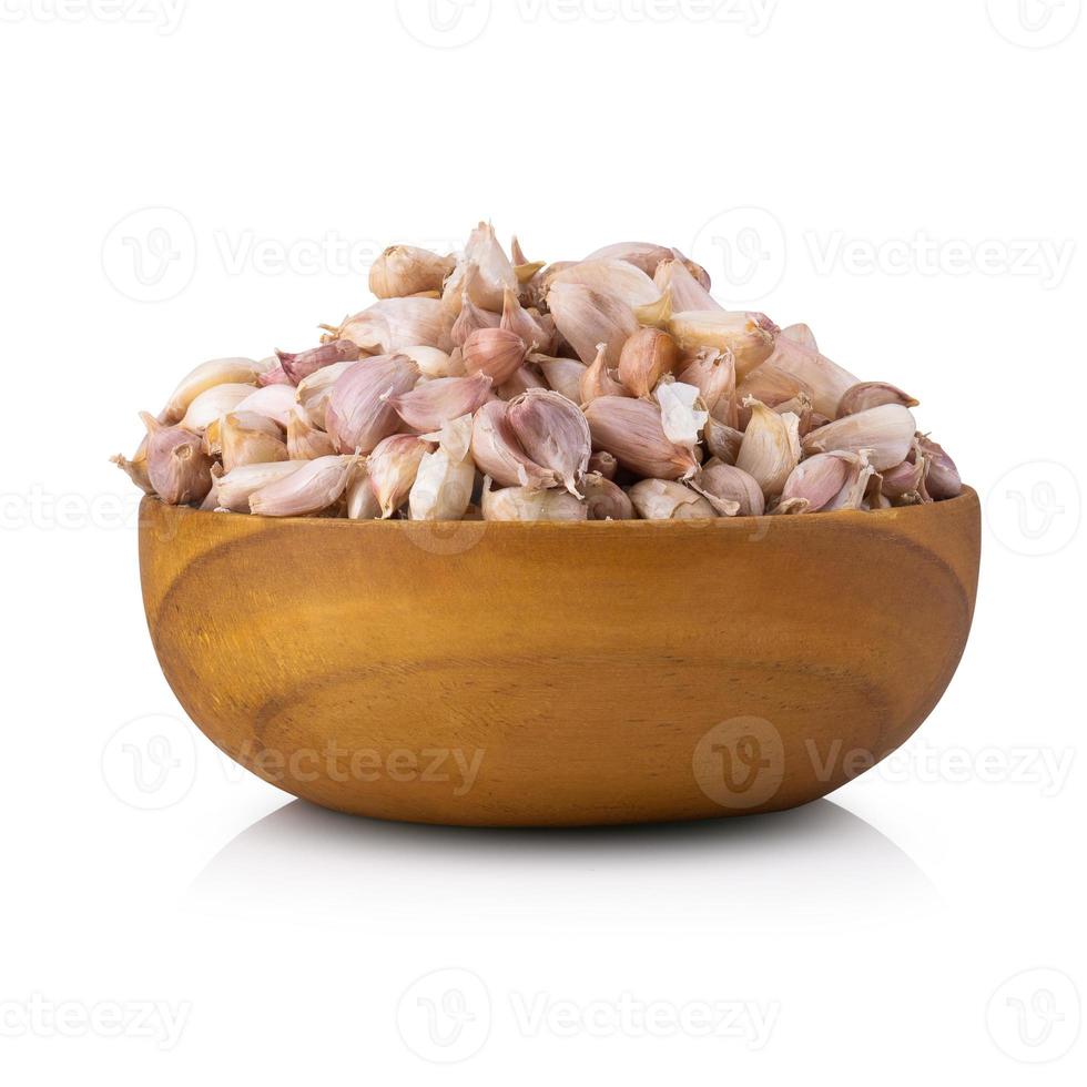 Garlic Group in wooden bowl isolated on white background. photo